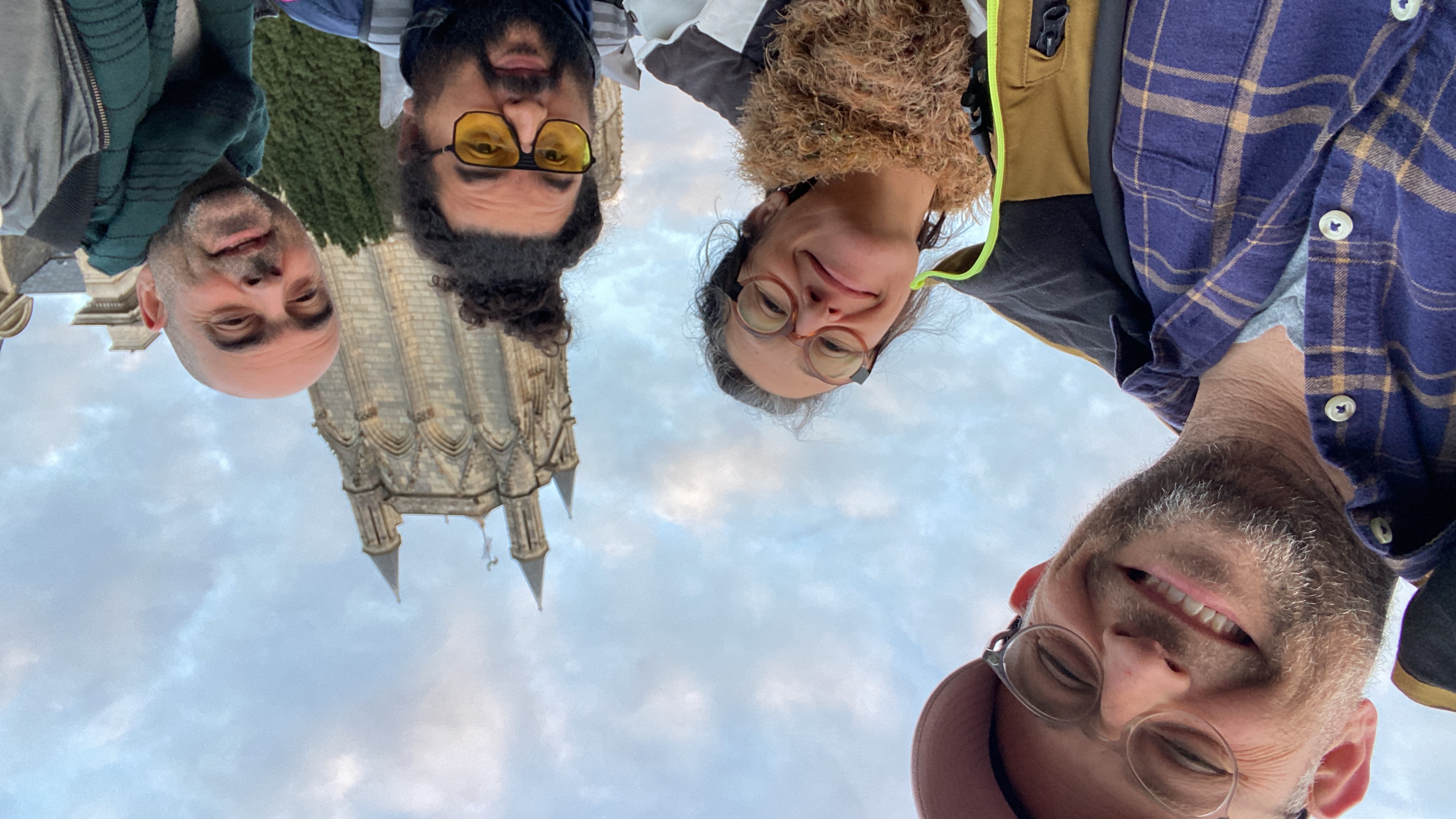 People at a concert facing the stage with various colours of paint powder in the air